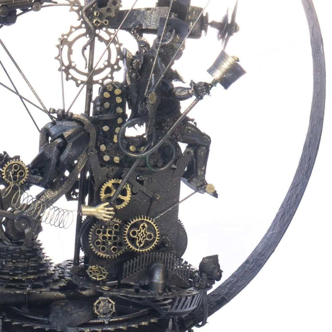 Steampunk-inspired recycled sculpture featuring a winged minotaur form built from broken toys, gears, metal parts and found materials, all finished in a dark bronze patina within a circular frame.