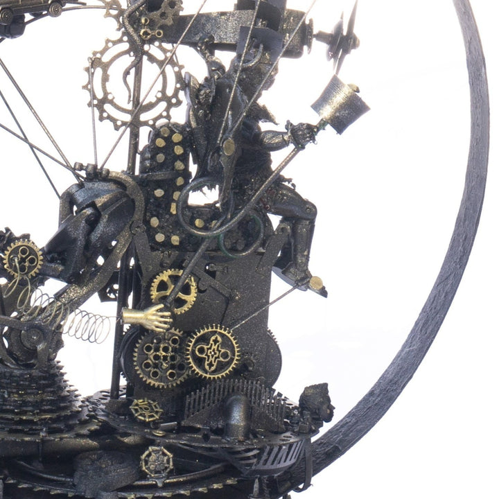Steampunk-inspired recycled sculpture featuring a winged minotaur form built from broken toys, gears, metal parts and found materials, all finished in a dark bronze patina within a circular frame.