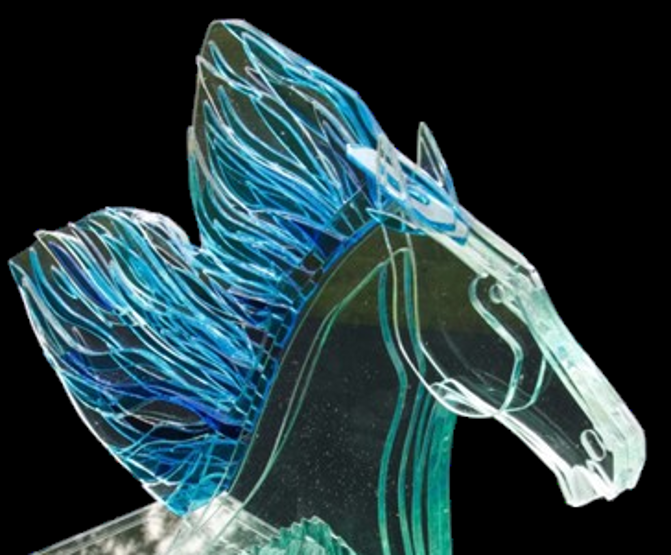 Bonded glass sculpture of a horse titled Winner, featuring a stylised mane in layered blue and turquoise glass, set on a rectangular base, suitable for indoor or outdoor display.