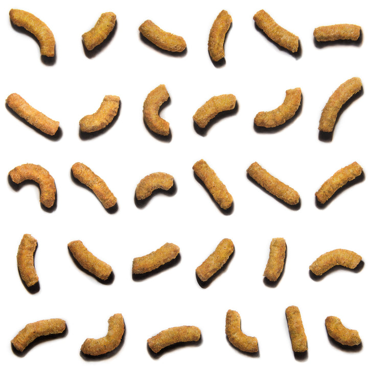 Baked Wotsits 16.5g Pack 82 KCal, 2024 by Simon Taylor – photorealistic oil painting on linen depicting rows of curved orange corn snacks arranged against a white background, each crisp rendered with detailed texture, granular surface and soft shadow.