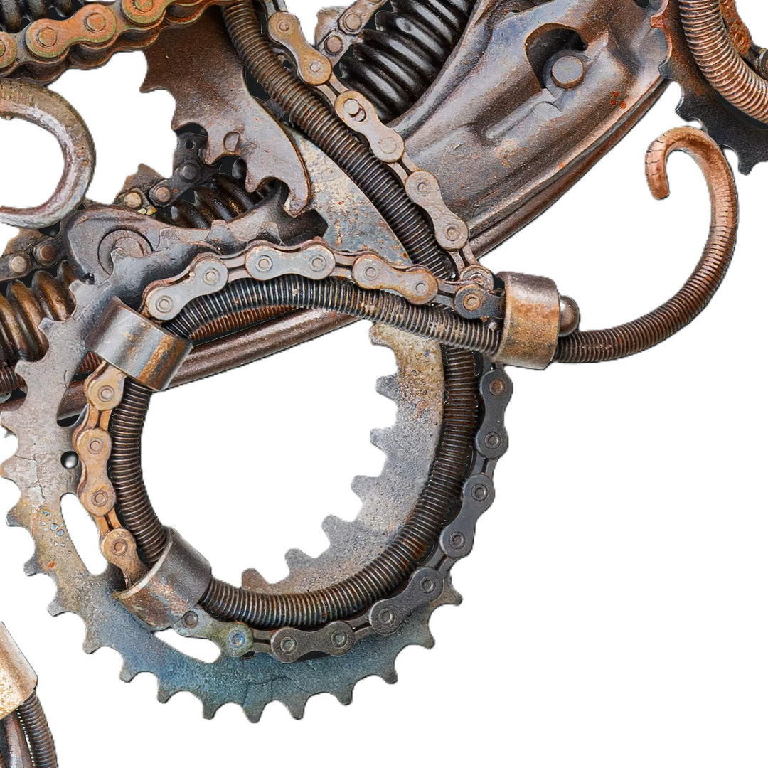 Intricate octopus sculpture crafted from reclaimed metal and gears, blending steampunk style with marine form.