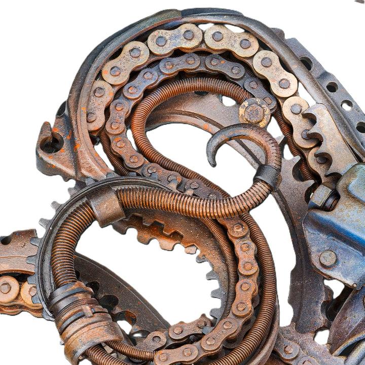 Intricate octopus sculpture crafted from reclaimed metal and gears, blending steampunk style with marine form.