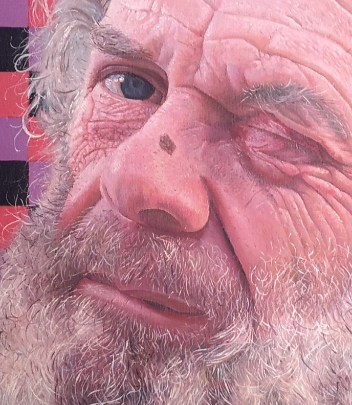 Anthony by James Earley — a hyperrealist oil portrait of a bearded man with expressive eyes, set against a vivid checkerboard background of purples, reds, and blacks. Every line, wrinkle, and hair is painted in meticulous detail, capturing the complexity of emotion in his wry expression.