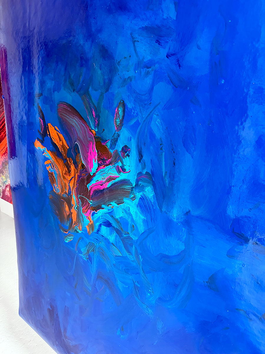 Large abstract painting “Into the Blue” by Swarez — deep ocean-inspired composition with layered shades of cobalt, ultramarine, turquoise, and teal blue. Vivid bursts of fiery orange, vibrant fuchsia, aqua, and rich purple emerge in the centre, with swirling, glossy enamel textures creating movement and depth.