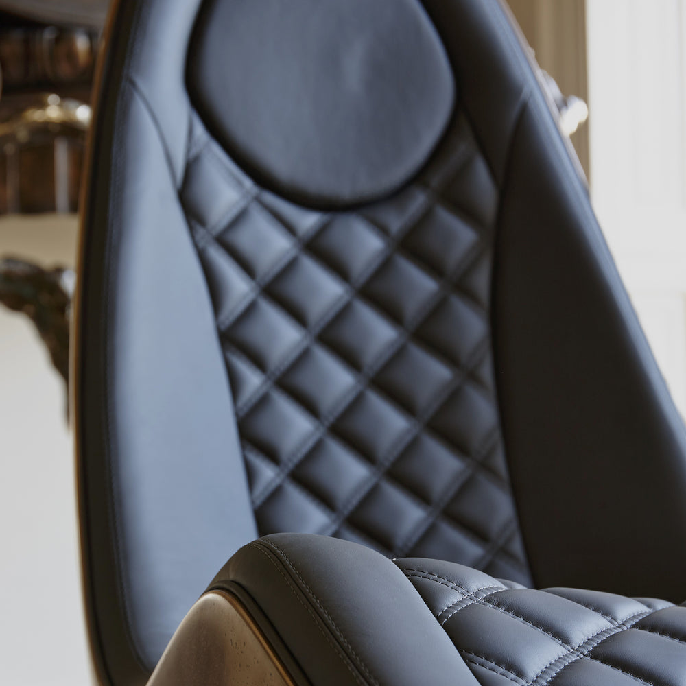 “Caillou Chaise – Leather & Bronze” by Ben Rousseau – a sculptural chaise combining deep navy quilted leather with a liquid bronze base. A handcrafted fusion of strength and sophistication, redefining modern luxury furniture.

