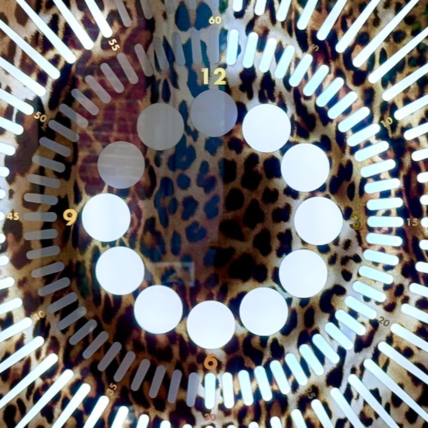 “Tempus Leopard Edition” by Ben Rousseau – a limited-edition illuminated timepiece crafted from leopard-printed glass and brass-tinted aluminium with LEDs. A bold fusion of glamour, light, and contemporary design.

