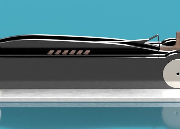 Limited-edition Bluebird V 1935 sculpture by Jonny Ambrose — layered black polished acrylic body with walnut tail-fin and polished nickel-plated aluminium details on a sleek white acrylic or brushed aluminium plinth, celebrating Malcolm Campbell’s 1935 land speed record at Bonneville Salt Flats.