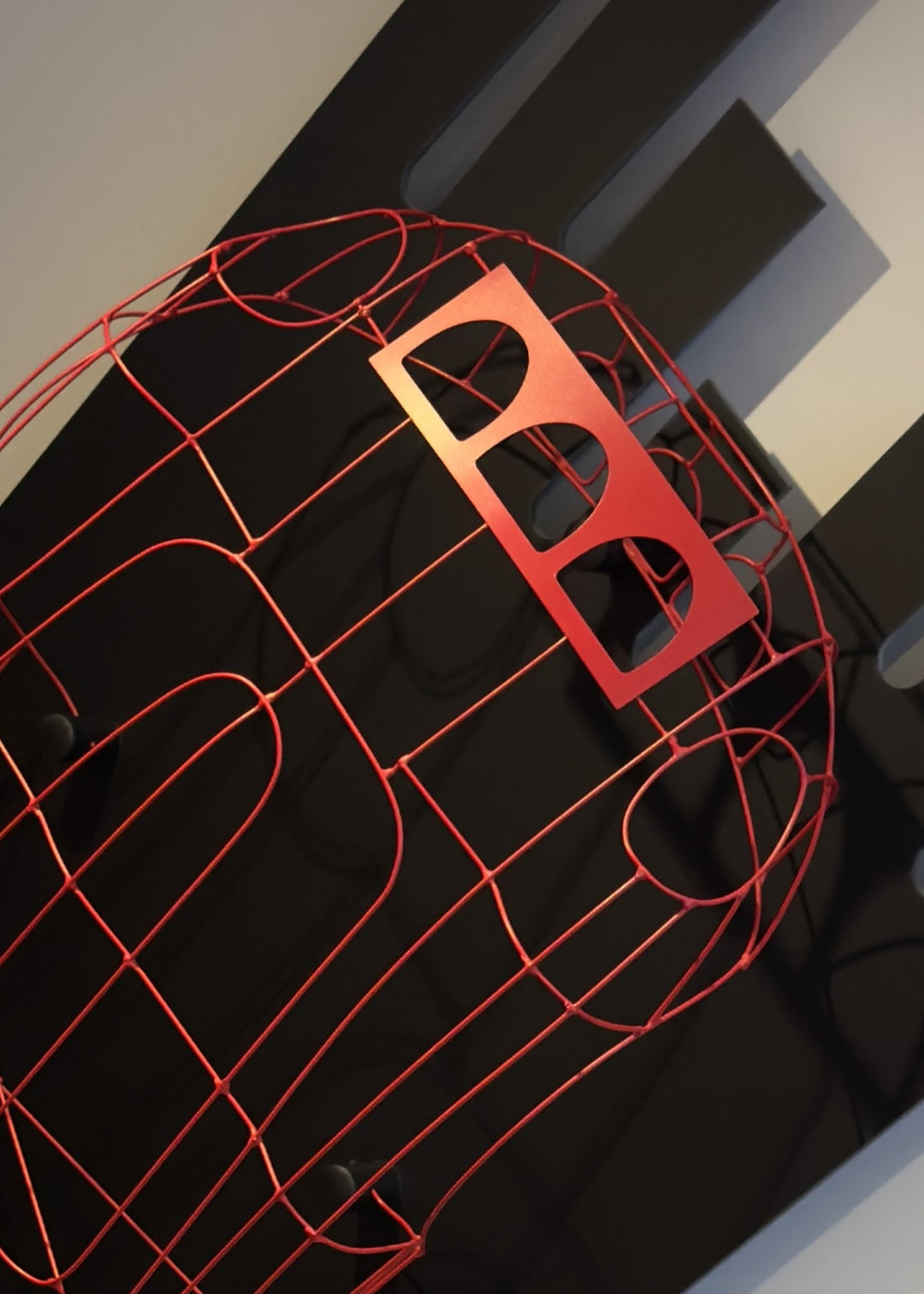 Handcrafted red wire sculpture of the Ferrari 250 GTO by Chris Twitchell, inspired by the original coachbuilder’s buck used to form the legendary 1962 Series 1 body. Finished in Rosso Chiaro red, this intricate wall-mounted artwork captures the elegance, form, and aerodynamics of Scaglietti’s design through sculptural craftsmanship and precision engineering.