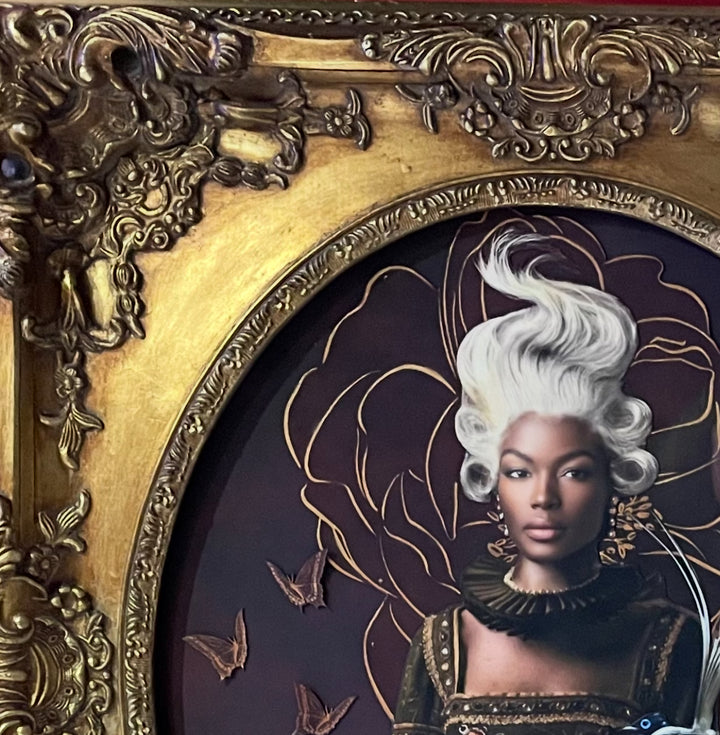 Catarina Diaz’s Between Two Worlds, analogue collage with Somerset Enhanced Velvet and oil on canvas board. Regal Black woman with flowing white hair, fox in her lap, small bird on shoulder, set against deep burgundy floral backdrop in ornate antique frame.