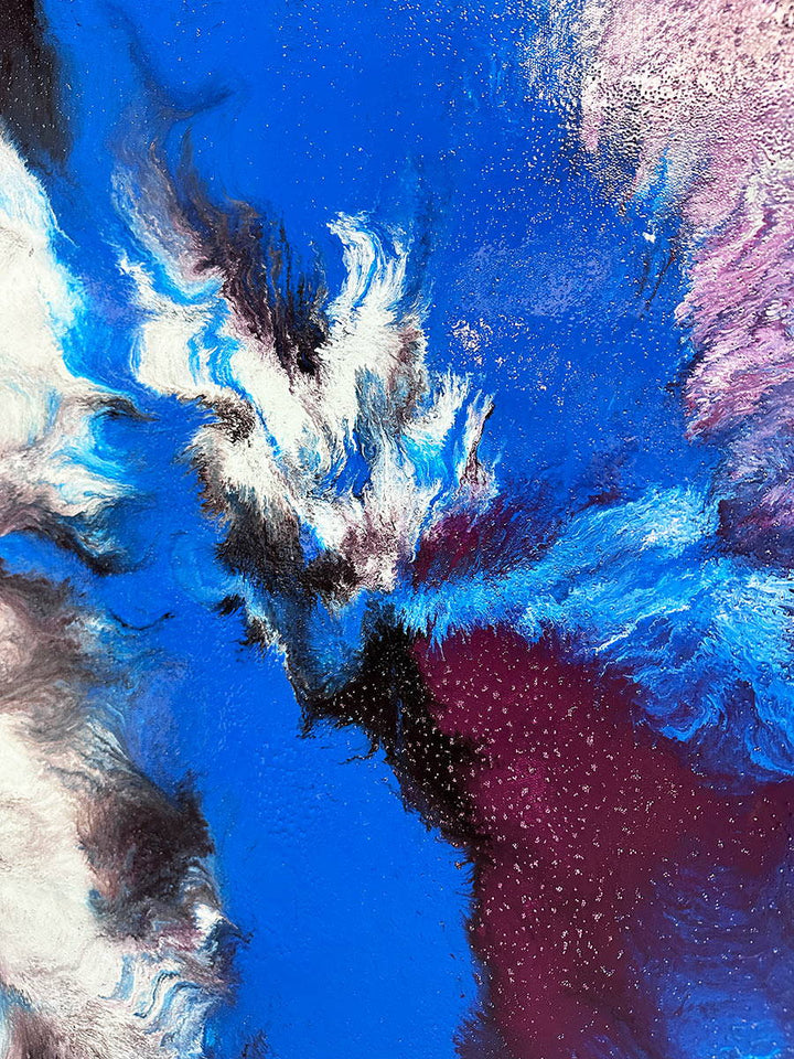 Large abstract painting “Atomic Butterfly” by Swarez — dramatic centrifugal spin art with explosive bursts of cobalt blue, electric turquoise, deep violet purple, crisp white, and black radiating from the centre across a heavily textured enamel surface.
