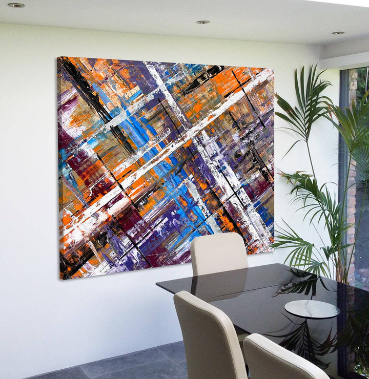 Large abstract painting “Harmonia” by Swarez — layered intersecting lines and blocks in vivid cobalt blue, burnt orange, gold, white and black, with deep royal purple and burgundy undertones. Strong white cross overlay creates depth and structure across a richly textured enamel surface.