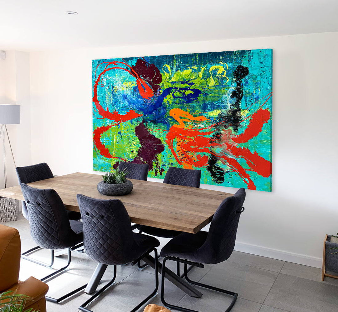 Large abstract painting “Infinite Light” by Swarez — vibrant sweeping strokes of scarlet red, fiery orange and deep burgundy layered over a luminous turquoise and lime green base, with accents of cobalt blue and black. Highly textured enamel surface with bold movement and glossy, light-catching details.