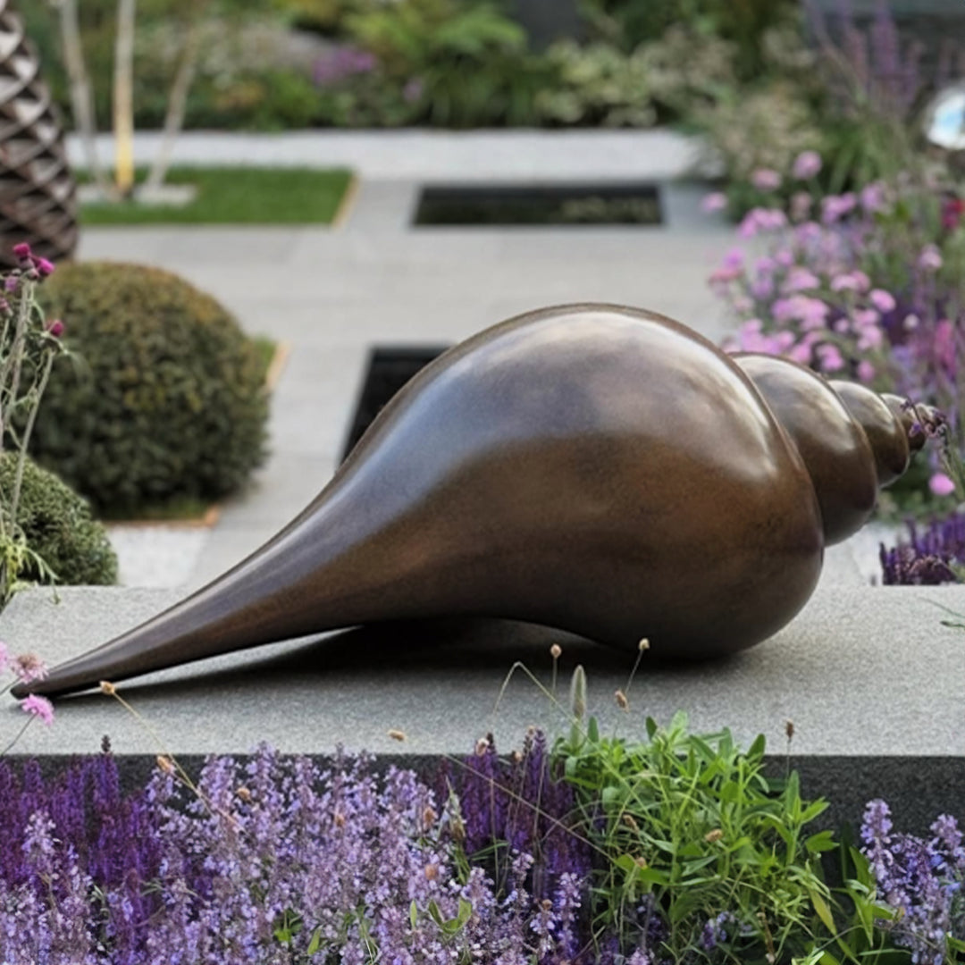 Patinated bronze Shell sculpture by James Parker, inspired by the whelk shell with a smooth spiral form shaped by coastline, memory and natural geometry.