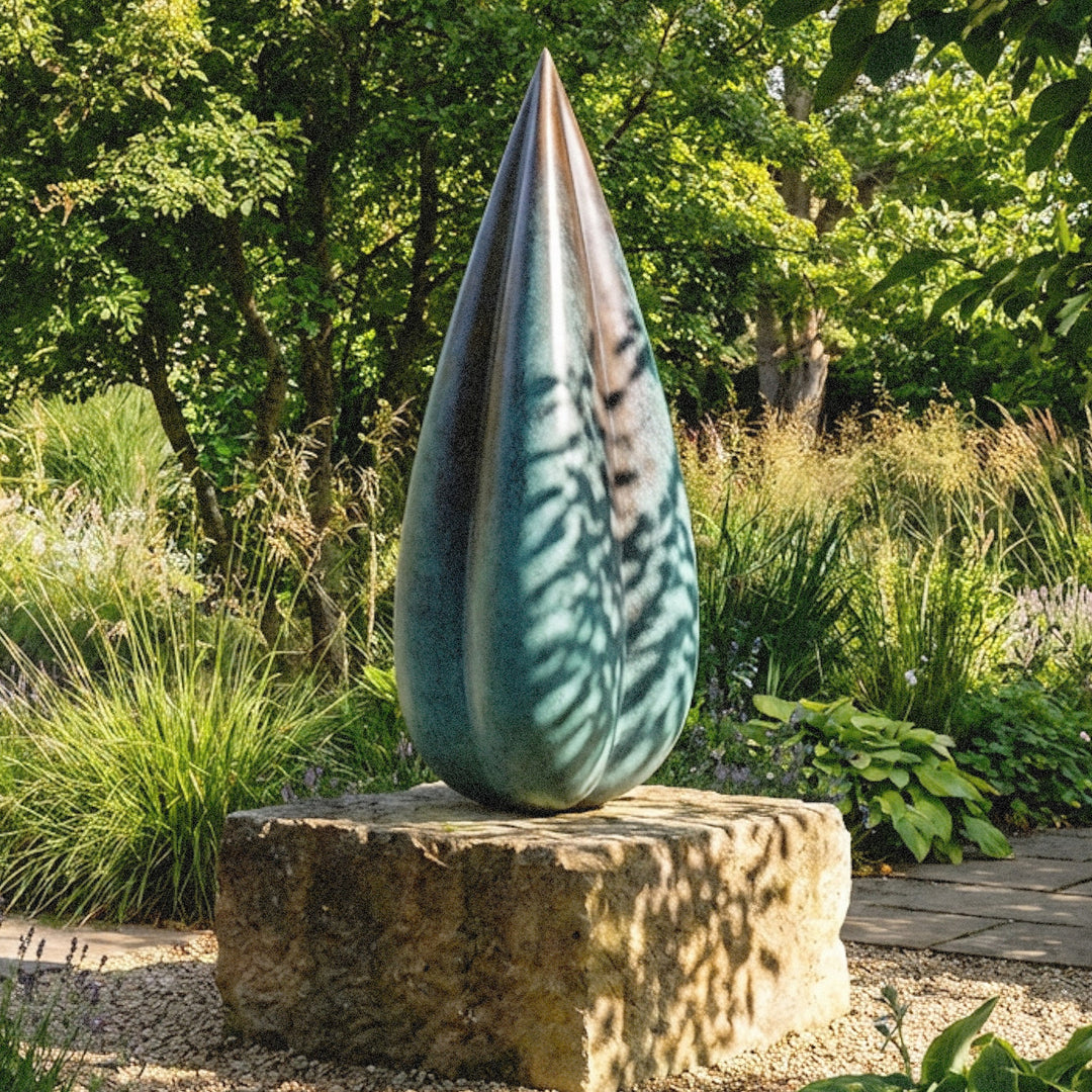 Patinated bronze Bud sculpture by James Parker, with smooth swelling curves, a tapered organic form and a calm sense of growth and renewal.