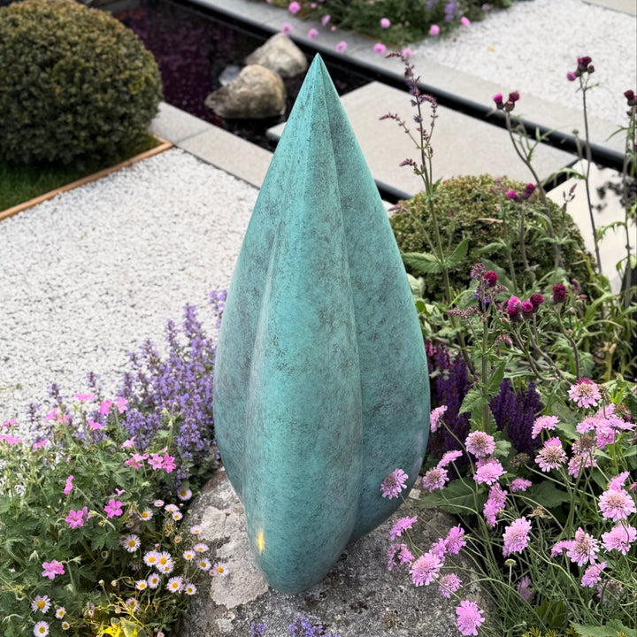 Patinated bronze Bud sculpture by James Parker, with smooth swelling curves, a tapered organic form and a calm sense of growth and renewal.