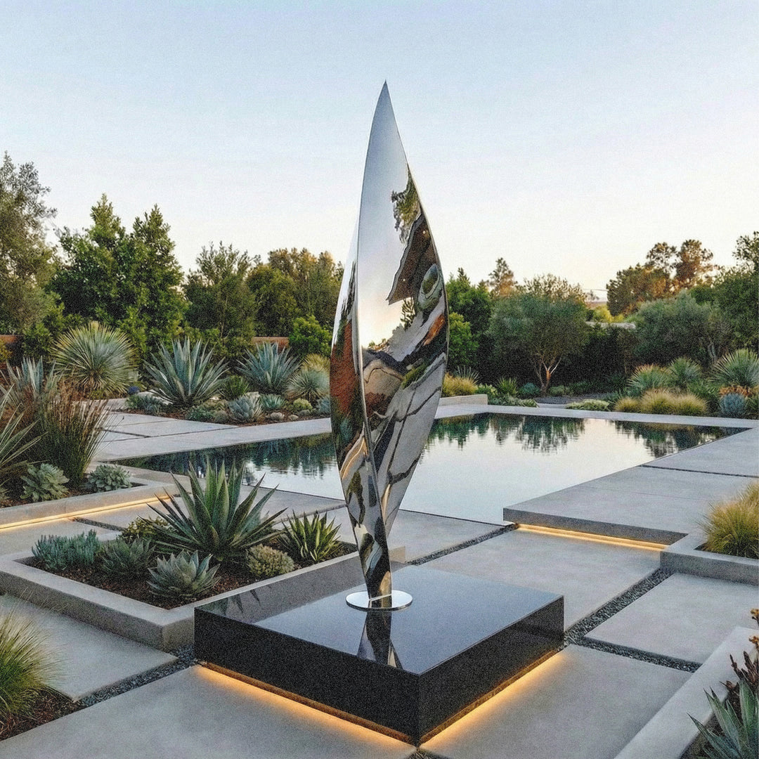 Mirror-polished stainless steel Leaf sculpture by James Parker, with a tall twisting three-sided form inspired by balance, movement and natural renewal.