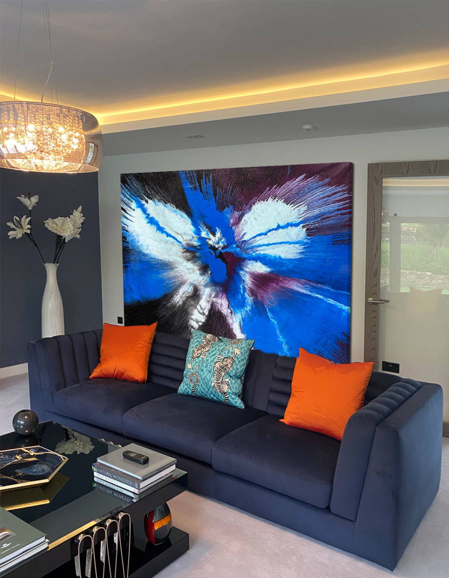 Large abstract painting “Atomic Butterfly” by Swarez — dramatic centrifugal spin art with explosive bursts of cobalt blue, electric turquoise, deep violet purple, crisp white, and black radiating from the centre across a heavily textured enamel surface.