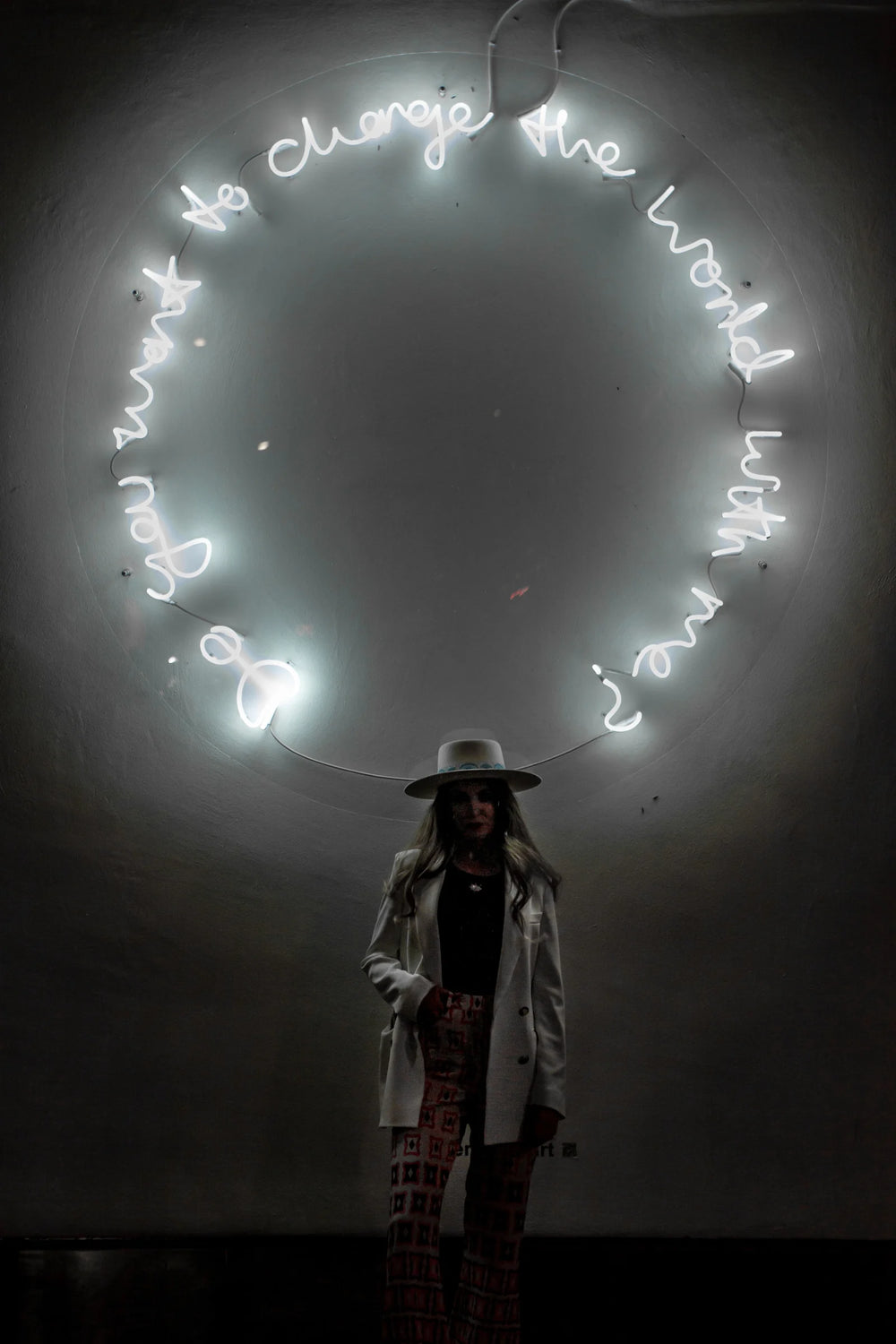 Do You Want To Change The World With Me? by Lauren Baker, a unique large-scale neon artwork in white neon mounted on Perspex, featuring glowing handwritten text arranged in a circular form, radiating light and symbolic invitation.