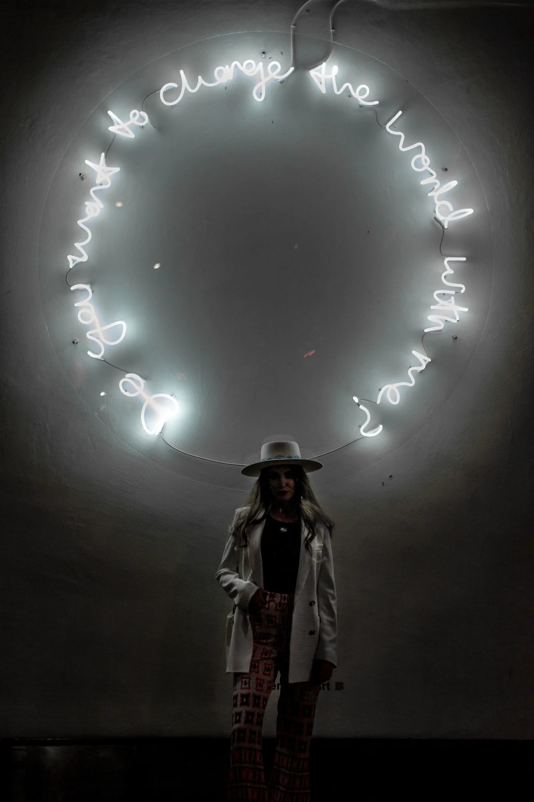 Do You Want To Change The World With Me? by Lauren Baker, a unique large-scale neon artwork in white neon mounted on Perspex, featuring glowing handwritten text arranged in a circular form, radiating light and symbolic invitation.