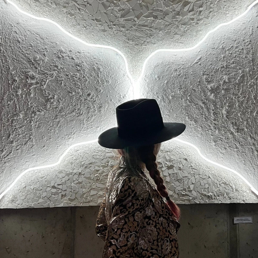 Do You Want To Change The World With Me? by Lauren Baker, a unique large-scale neon artwork in white neon mounted on Perspex, featuring glowing handwritten text arranged in a circular form, radiating light and symbolic invitation.