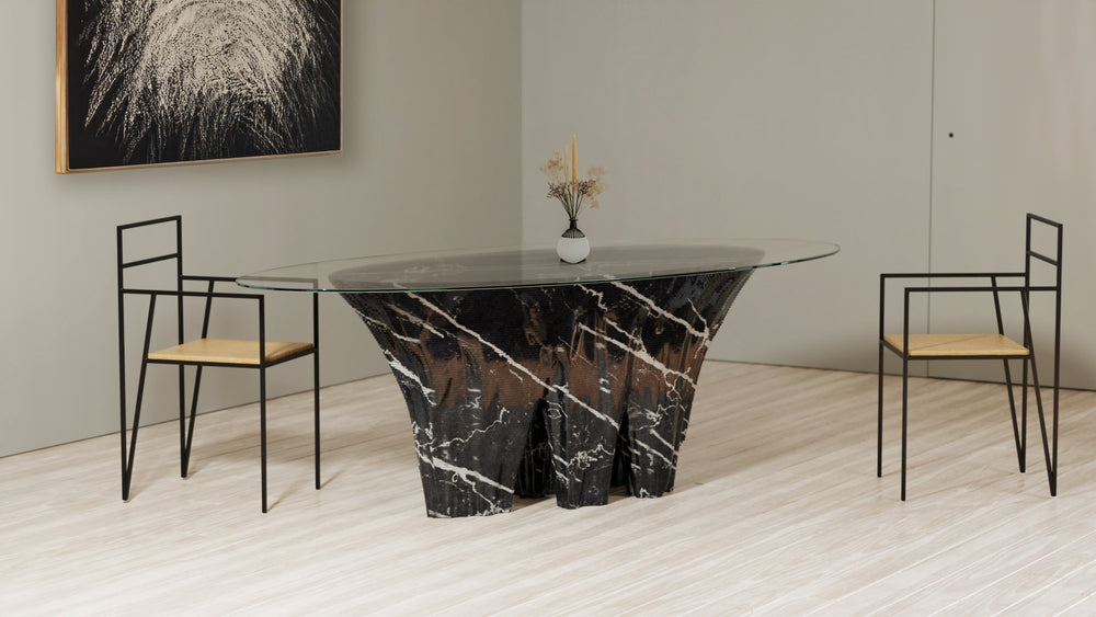 Duffy London Monument Valley Dining Table carved from marble with sculptural canyon-like base and glass top, inspired by natural rock formations.