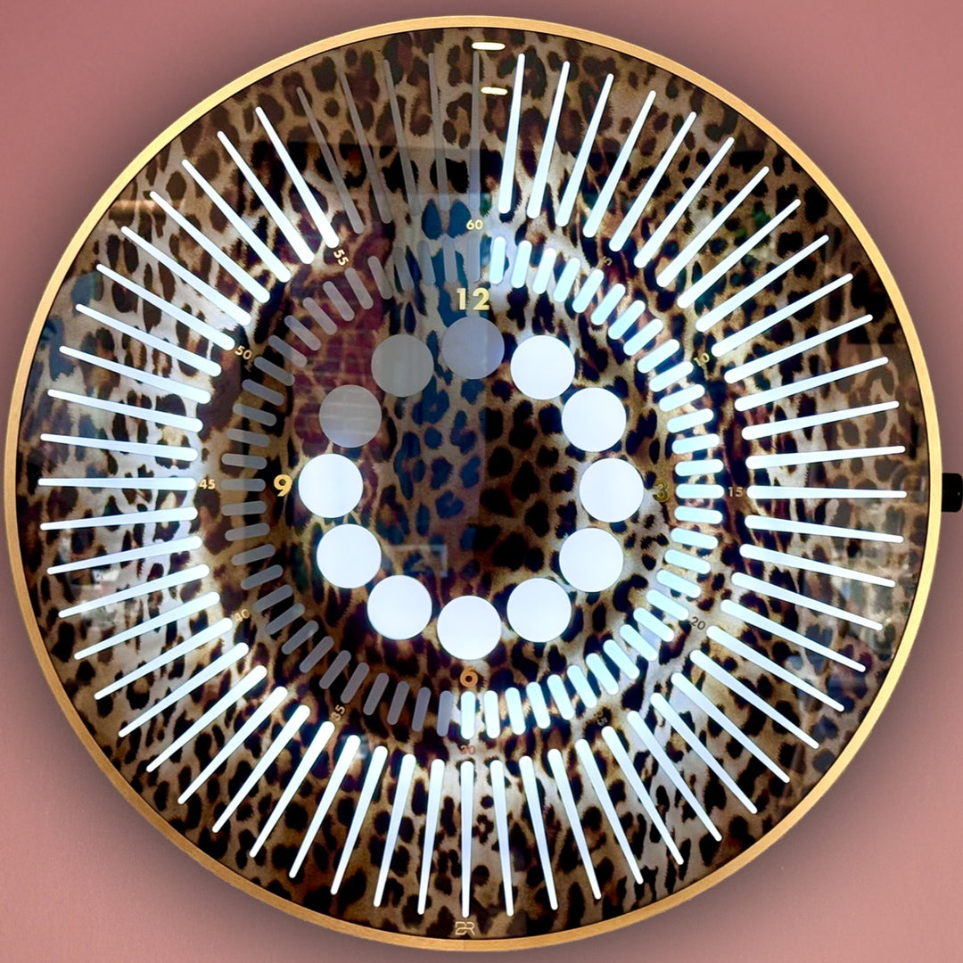 “Tempus Leopard Edition” by Ben Rousseau – a limited-edition illuminated timepiece crafted from leopard-printed glass and brass-tinted aluminium with LEDs. A bold fusion of glamour, light, and contemporary design.

