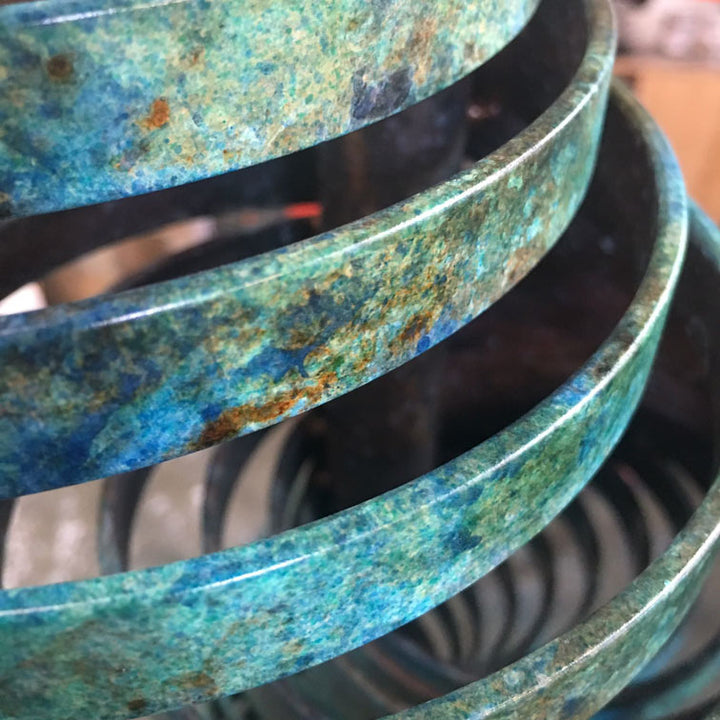 Vortex II by Thomas Joynes – a limited edition bronze sculpture with artisan patina, exploring Fibonacci-based forms through stacked, spiralling discs. The rich verdigris patina in green-blue and rust tones highlights the rhythmic, wave-like movement of the bronze layers. Mounted on a smooth Carrara marble base, the piece brings a sense of elegance and kinetic energy to any contemporary interior.