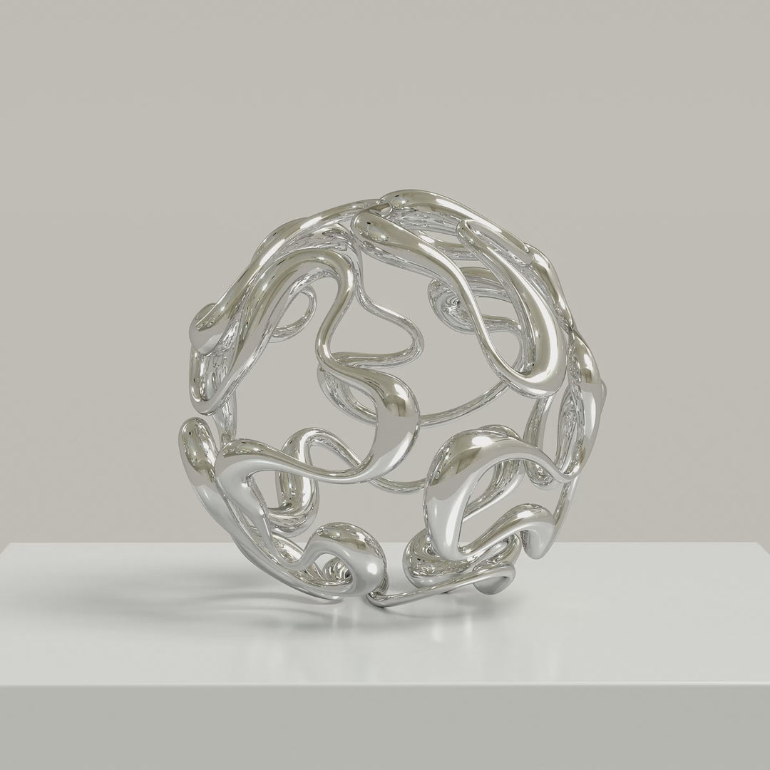 Video - Polished cast stainless steel sculpture by Yoni Alter, formed from a continuous, looping line that weaves organically into a perfect sphere. The reflective surface and open structure create a sense of movement, balance, and fluidity from every angle. Self-standing and orientation-free.