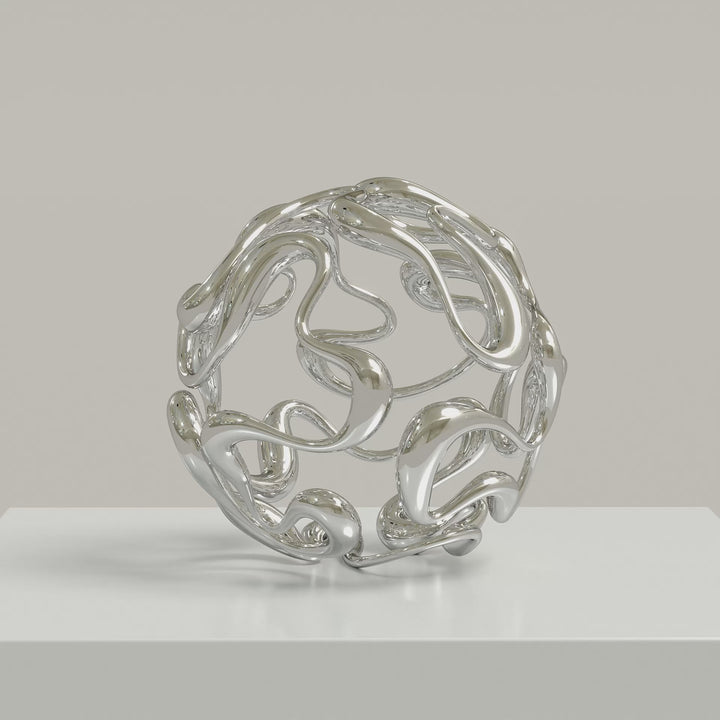 Video - Polished cast stainless steel sculpture by Yoni Alter, formed from a continuous, looping line that weaves organically into a perfect sphere. The reflective surface and open structure create a sense of movement, balance, and fluidity from every angle. Self-standing and orientation-free.