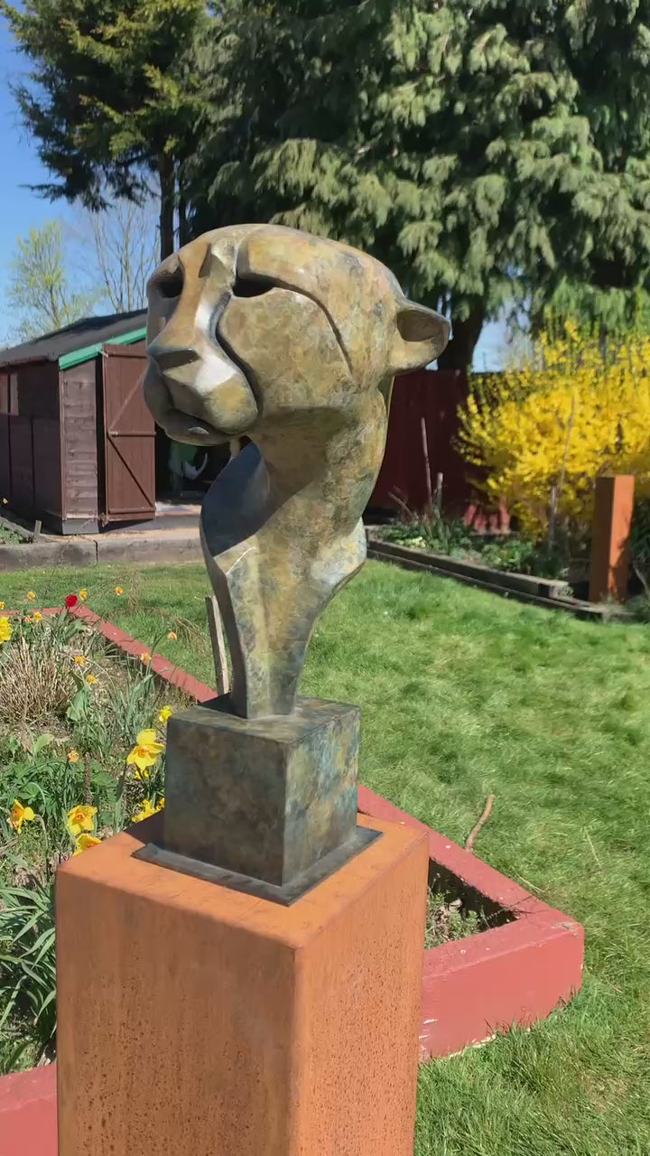 VIDEO - Marie Ackers Spirit of Savannah bronze sculpture, limited edition of 8. Stylised cheetah head and shoulders with flowing geometric lines, patinated in earthy green and bronze tones, evoking the spirit and elegance of Africa’s great cats.