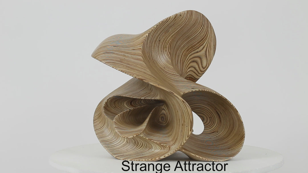 Hand-carved birch plywood abstract sculpture with flowing, mathematical forms inspired by chaotic systems and the Halvorsen Attractor.