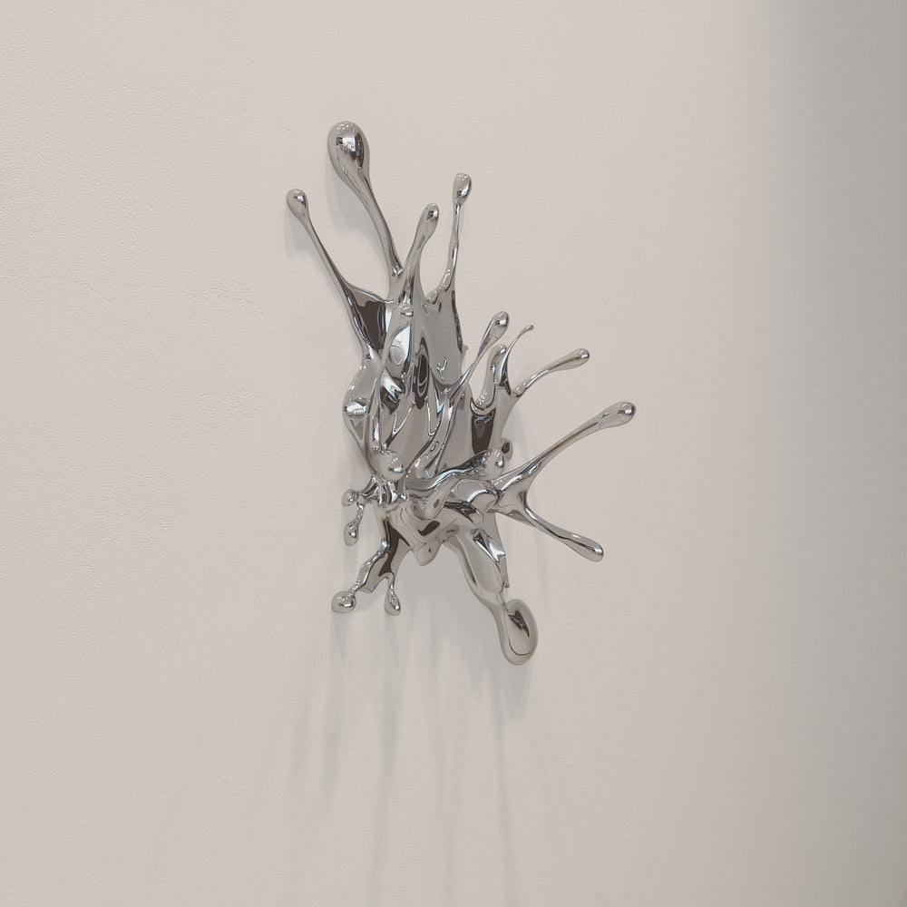 Wall-mounted stainless steel sculpture resembling a dynamic liquid splash frozen mid-motion, with high-shine chrome finish and flowing, organic extensions.