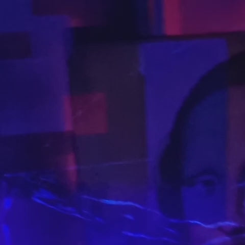 VIDEO - Mixed media portrait composition depicting a suited male figure with a bowler hat and green apple motif, fragmented and overlaid with classical portrait references, pixelated colour blocks and layered visual interruptions, rendered in acrylic paint with UV-reactive elements on a rectangular surface and presented within a bespoke multi-layer frame.