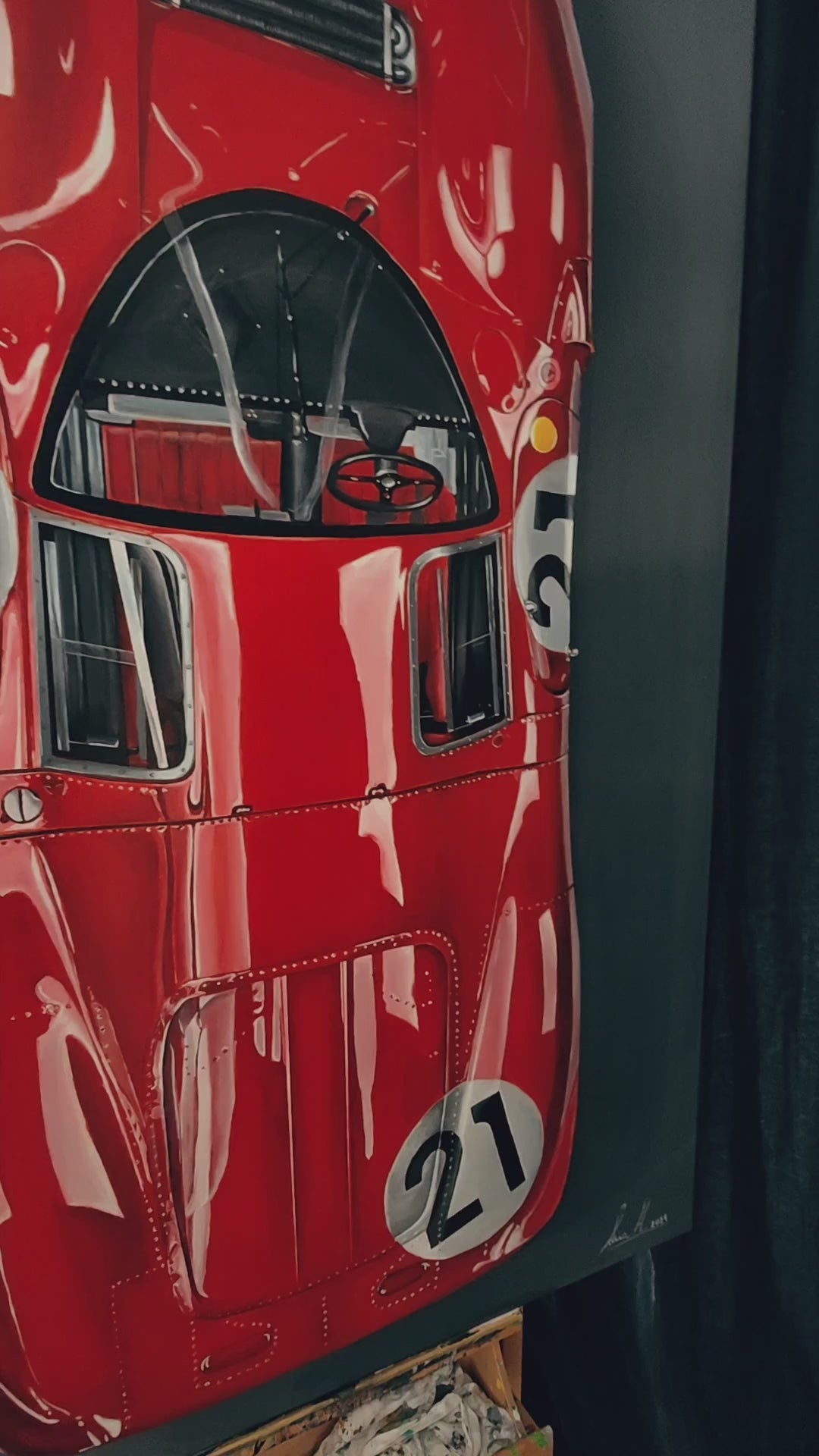 Video Hyperrealistic top-down portrait of the iconic Ferrari 330 P4 endurance racing car, painted in deep glossy Ferrari red with crisp white racing roundels bearing the number 21. Sleek aerodynamic curves, riveted bodywork, and black cockpit details are captured with extraordinary precision against a dark gradient background. A celebration of Italian engineering and motorsport heritage elevated to fine art.