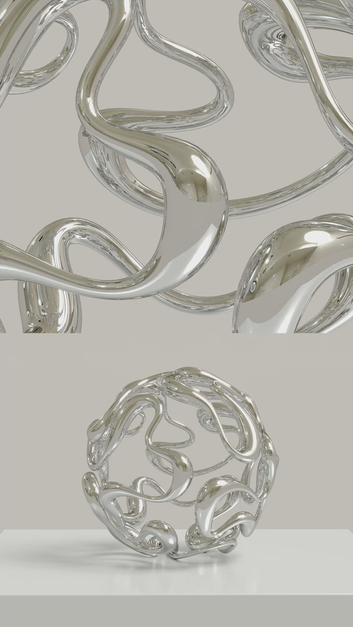 Video -Polished cast stainless steel sculpture by Yoni Alter, formed from a continuous, looping line that weaves organically into a perfect sphere. The reflective surface and open structure create a sense of movement, balance, and fluidity from every angle. Self-standing and orientation-free.
