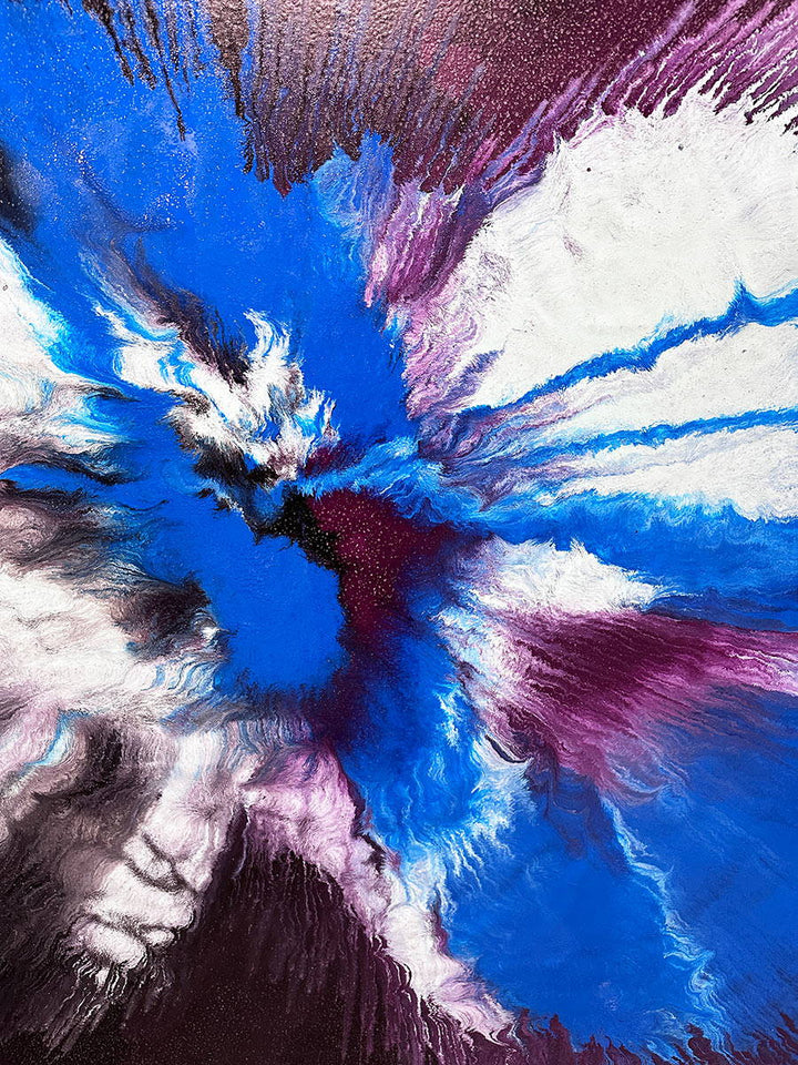 Large abstract painting “Atomic Butterfly” by Swarez — dramatic centrifugal spin art with explosive bursts of cobalt blue, electric turquoise, deep violet purple, crisp white, and black radiating from the centre across a heavily textured enamel surface.
