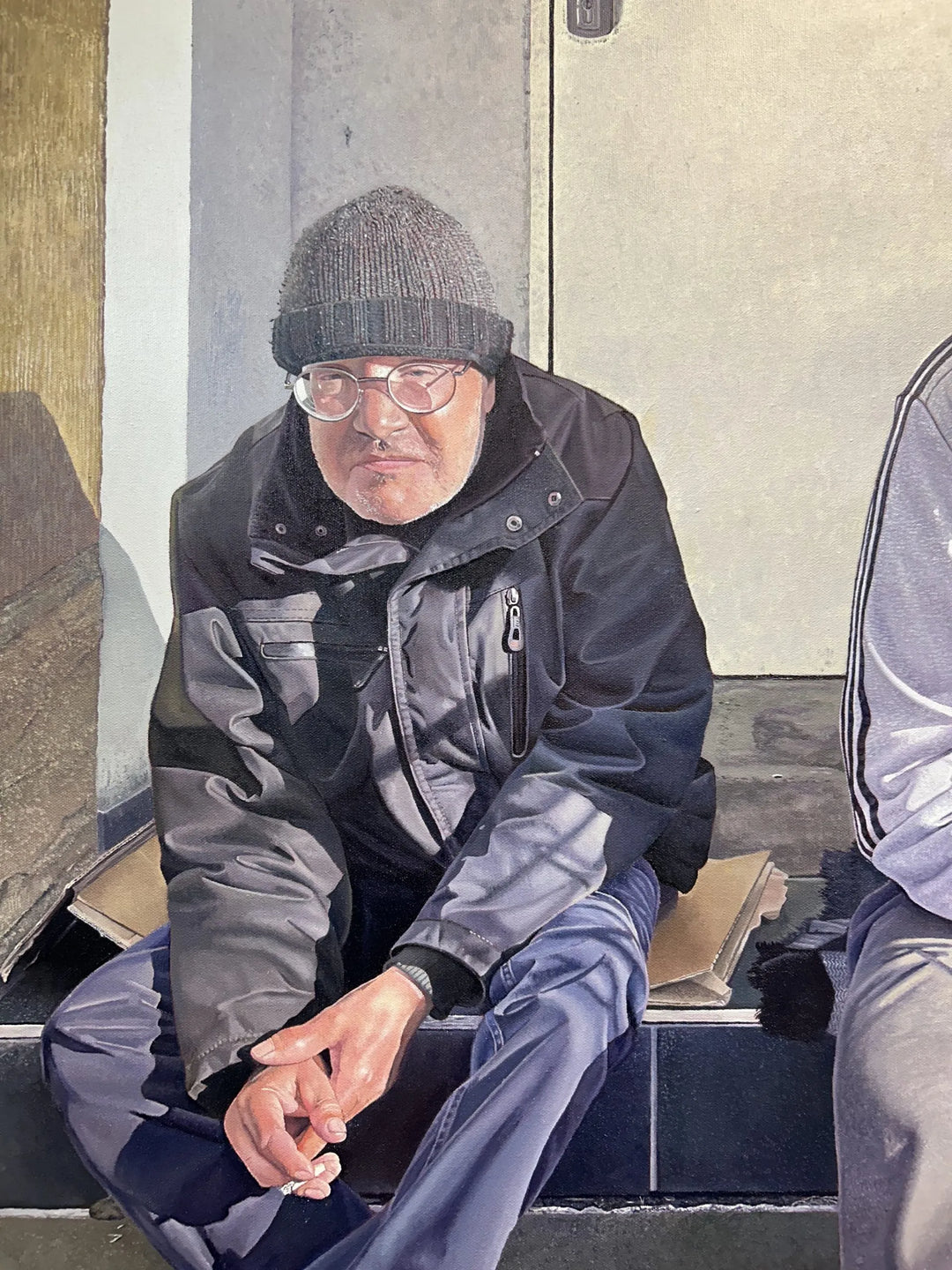 Original hyperrealist oil painting depicting two men seated side by side on a stone step in an urban doorway, capturing friendship, resilience, and quiet solidarity. Sunlight highlights weathered faces, worn clothing, and subtle gestures, conveying compassion, hardship, and human connection within a contemporary street setting.