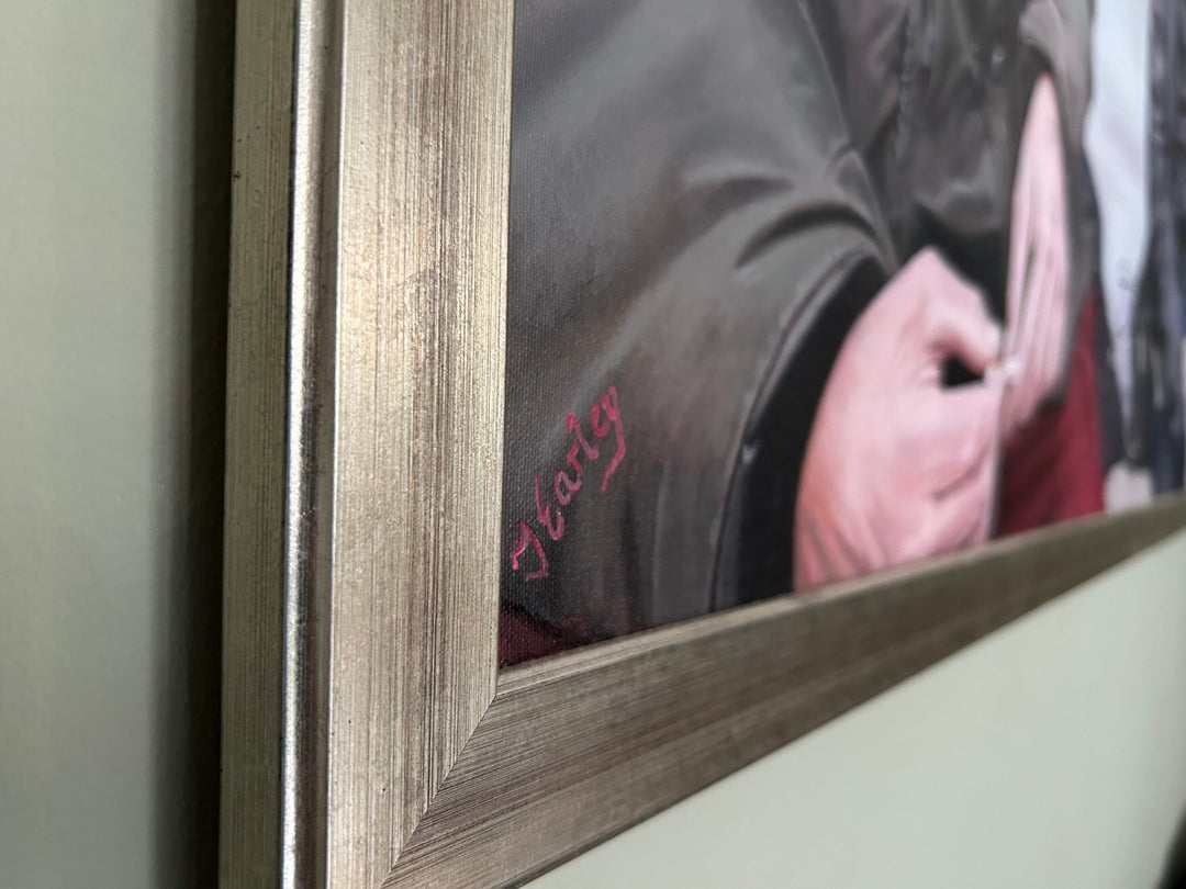 Waiting for the Ginger Bread Man by James Earley — a hyperrealist oil painting depicting two homeless individuals seated closely together, capturing a moment of connection, resilience, and vulnerability against a softly surreal backdrop.